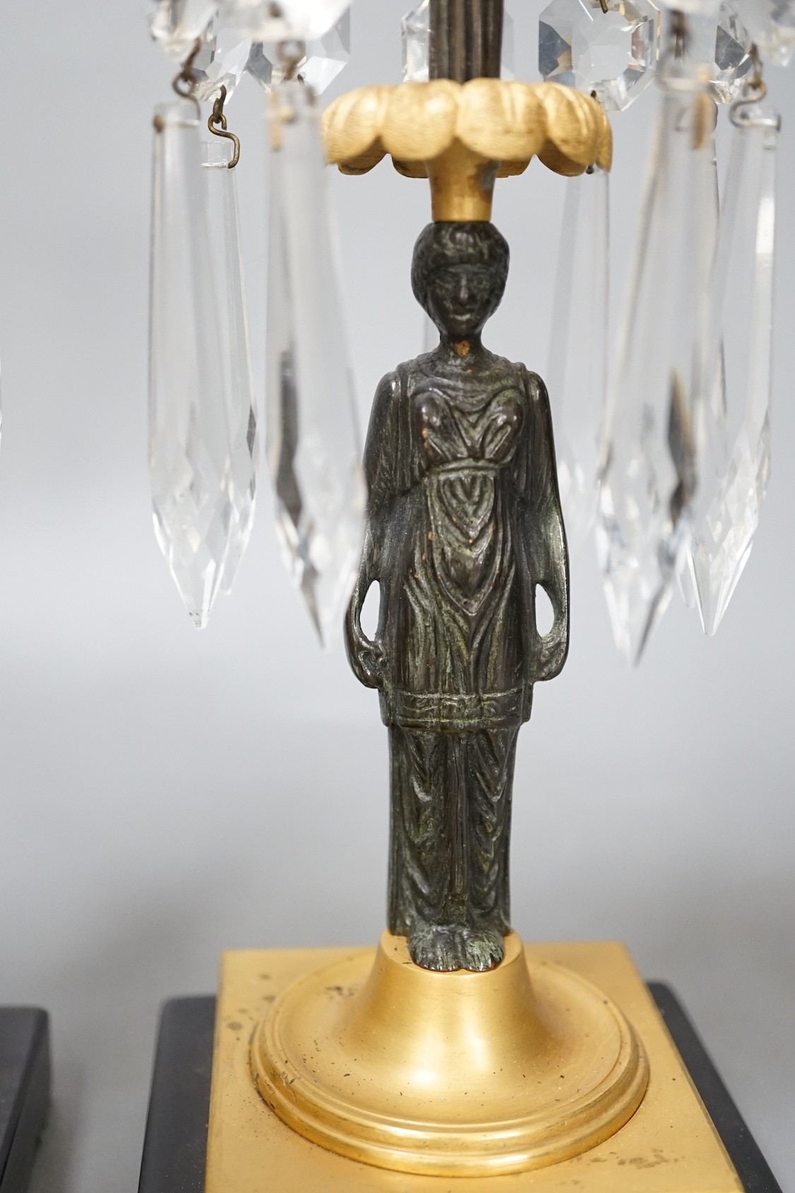A pair of figural lustre drop candlesticks - 29cm tall